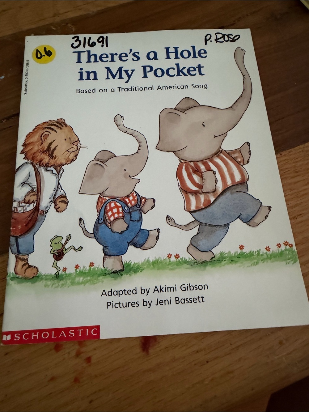 There's a Hole in My Pocket - Scholastic Children's Book (White, Blue, Red)